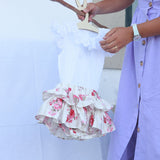 Tapa fraldas rosas e camisa