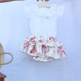 Tapa fraldas rosas e camisa